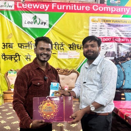Customer receiving a certificate from Leeway Furniture 2